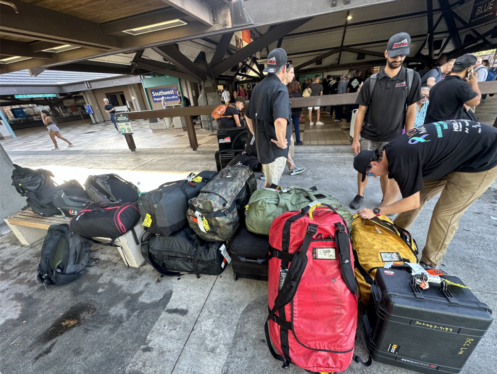 BCC Live team with their bags at Denver International Airport